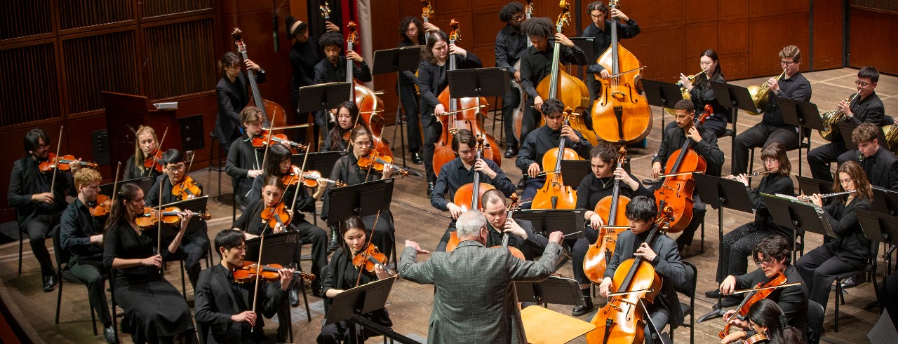 CCM Philharmonia performs on stage.