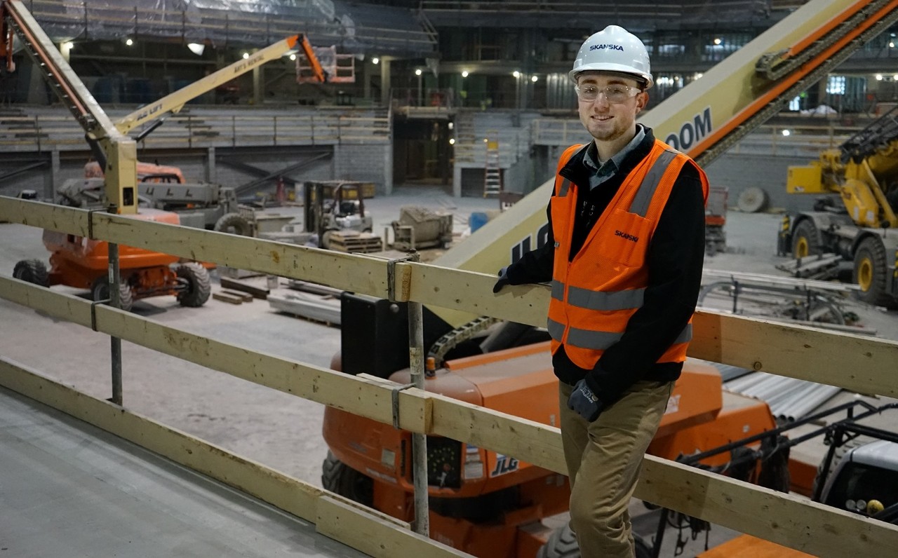 Bach poses in front of renovated arena's interior